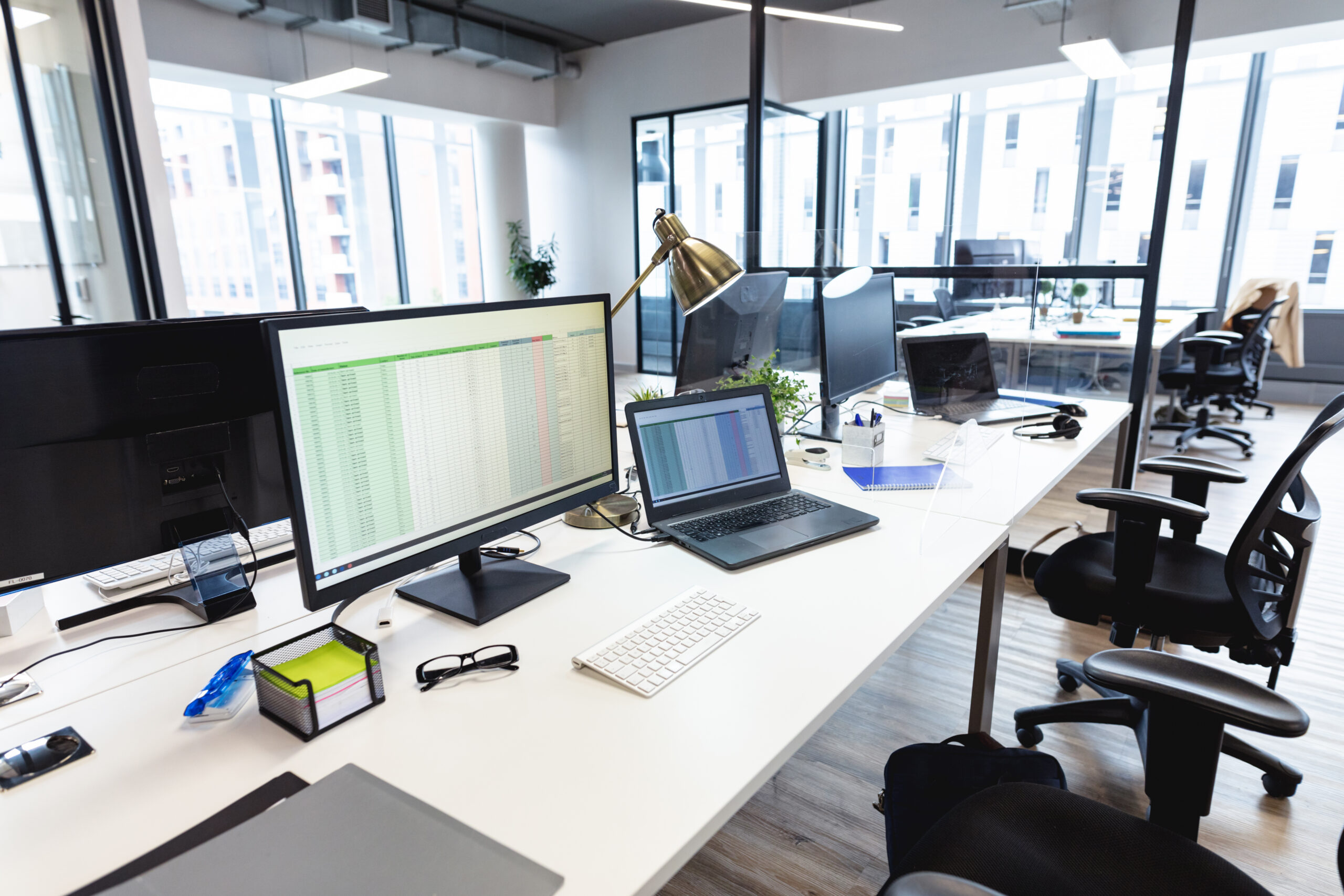 Interior of empty modern office with desks and computers. modern office of a creative design business.